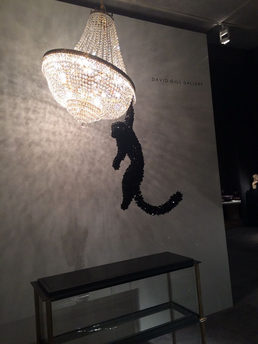 Barford's jeweled monkey hangs from a large chandelier in this kitchsy lighting fixture.