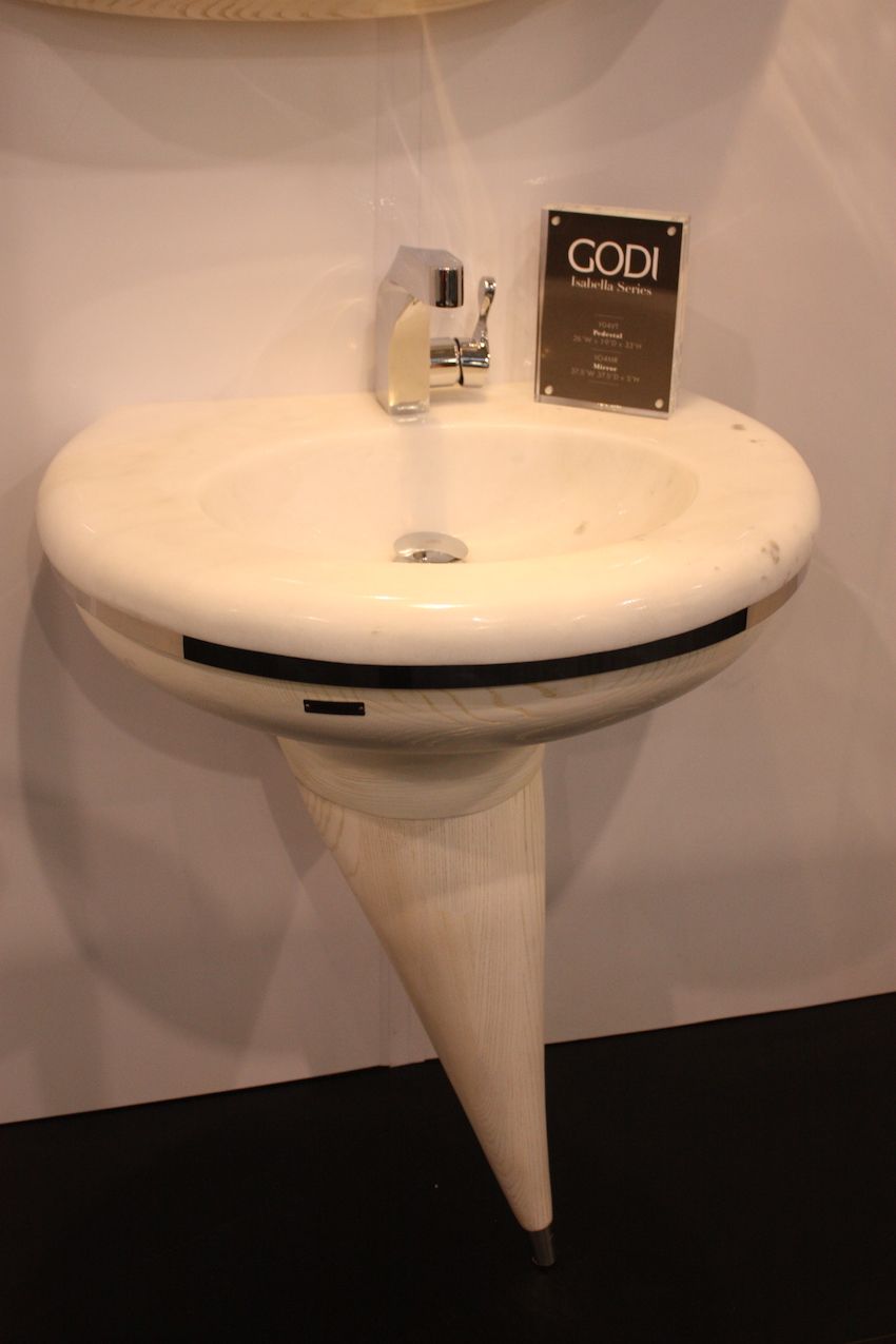 This funky basin is from Godi's Isabella Series. It is made with solid ash wood and solid marble sink top. The low profile design is perfect for smaller spaces and matching storage units are also available. The pedestal can be purchased oriented to either the left or right.