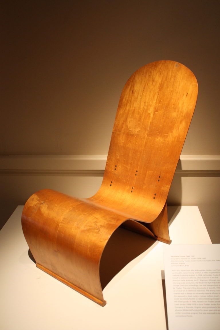 Laminated birch and brass comprise this chair.